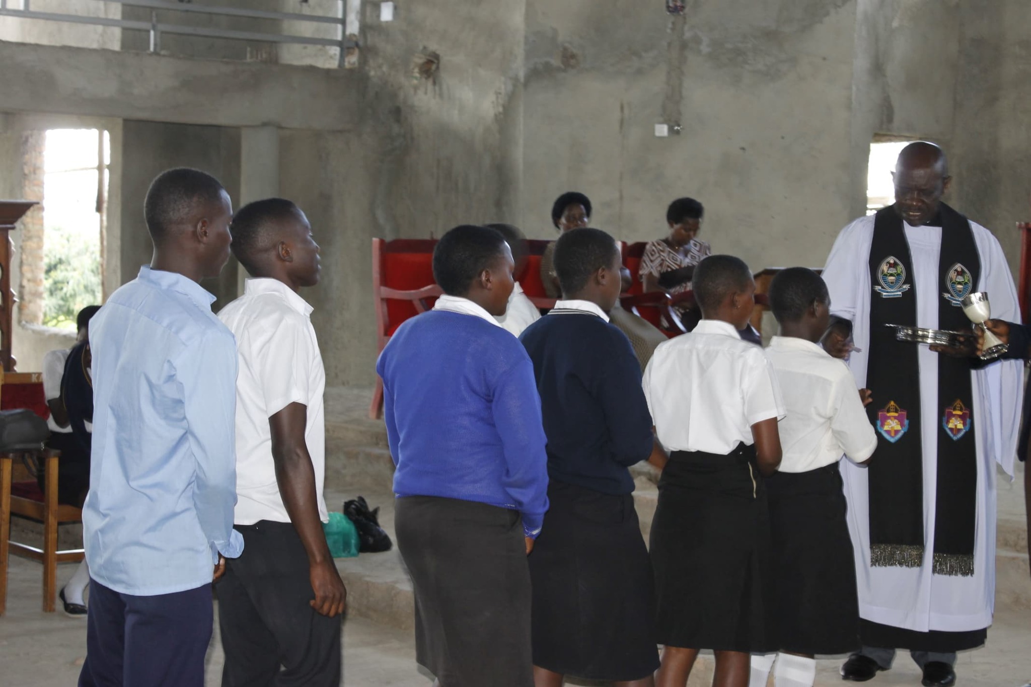 Students and clergy during a church service